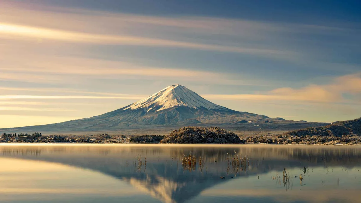 Sightseeing boat on Lake Kawaguchi with Mount Fuji behind on a Mount Fuji and Kawaguchiko day tour from Tokyo, Japan